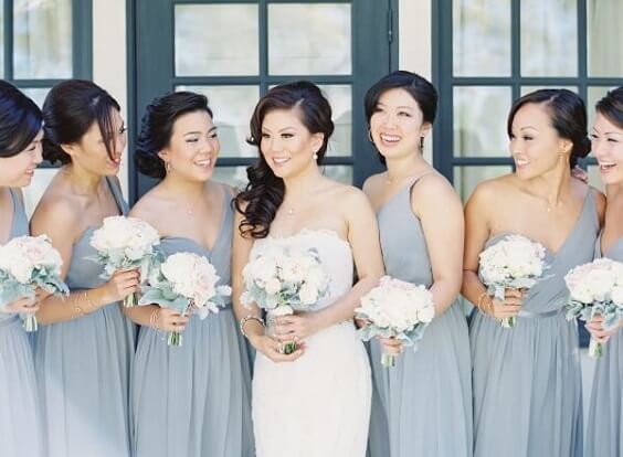 White bride and dusty blue bridesmaids for Blush and dusty blue wedding